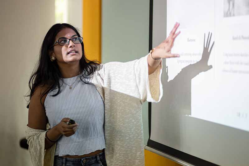 young woman presenting thesis